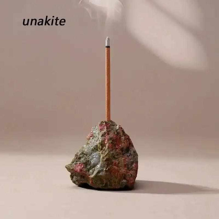 Raw Unakite stone incense holder with a rough, earthy texture and a drilled opening for a calming ritual space.