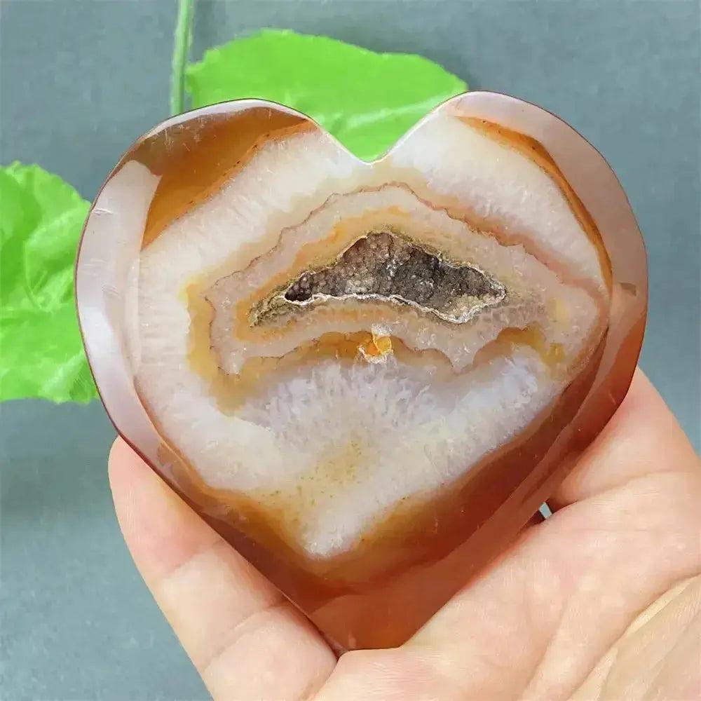 Natural Red Agate Heart Geode with sparkling druzy crystals, promoting strength and emotional balance.