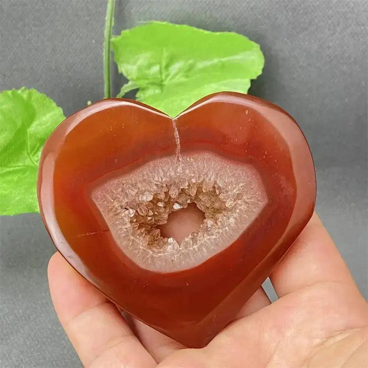 Natural Red Agate Heart Geode with sparkling druzy crystals, promoting strength and emotional balance.