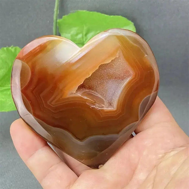 Natural Red Agate Heart Geode: Polished red and earthy heart-shaped agate with sparkling druzy crystals.