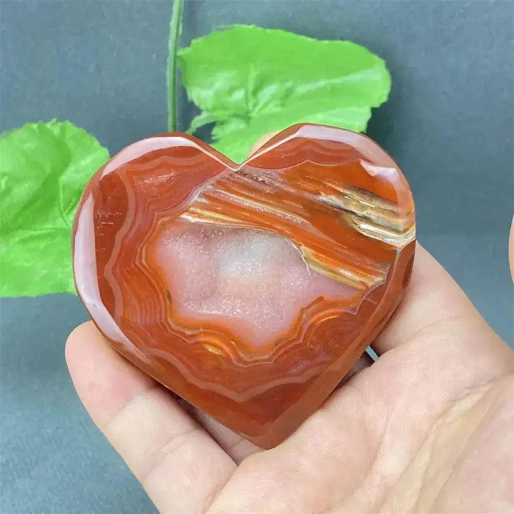 Natural Red Agate Heart Geode with sparkling druzy crystals, promoting strength and emotional balance.
