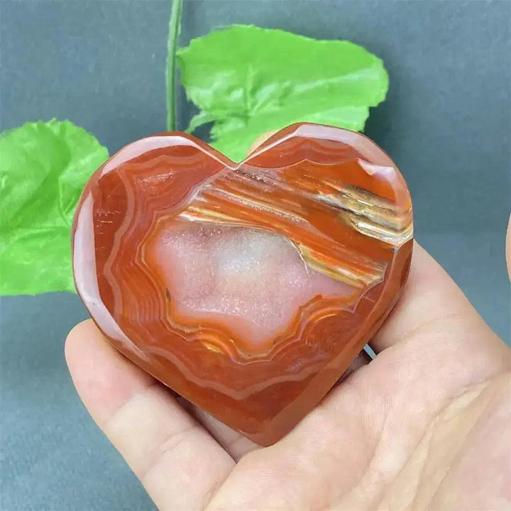 Natural Red Agate Heart Geode with sparkling druzy crystals, promoting strength and emotional balance.