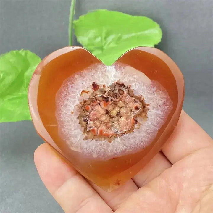 Natural Red Agate Heart Geode with sparkling druzy crystals, promoting strength and emotional balance.