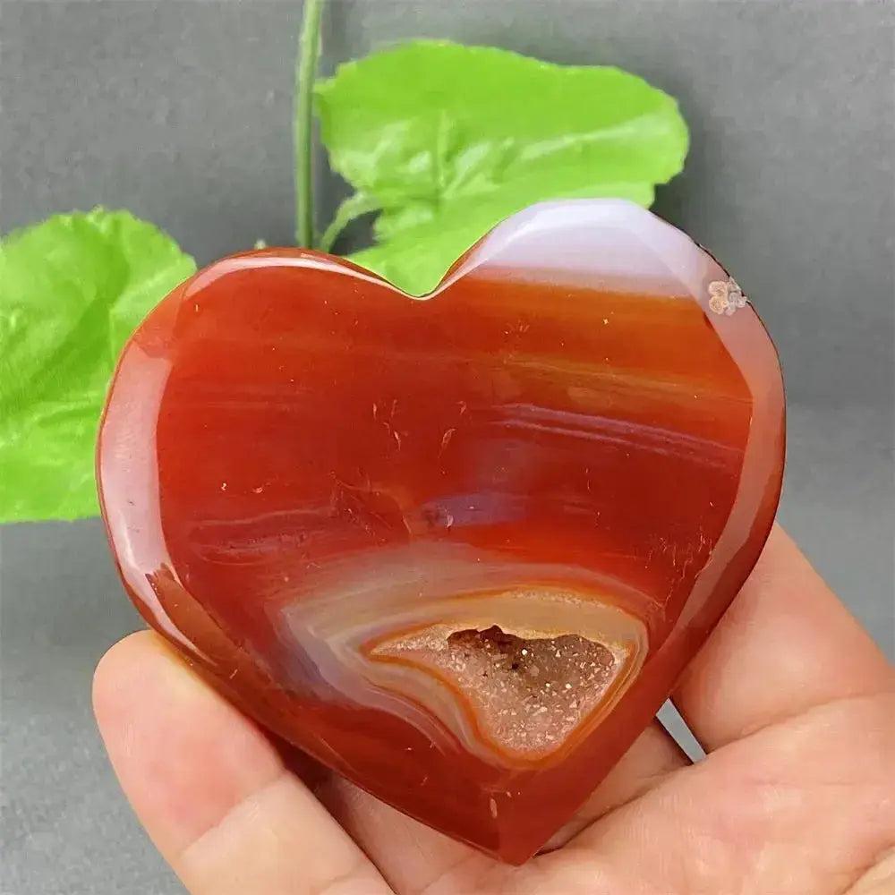 Natural Red Agate Heart Geode: Polished red heart with sparkling druzy crystal interior for strength and balance.