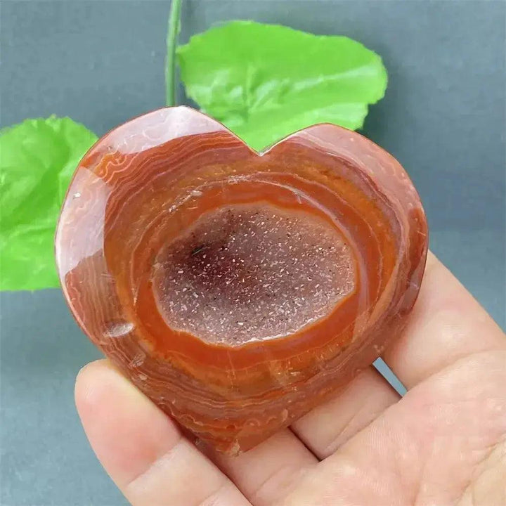 Natural Red Agate Heart Geode with sparkling druzy crystals, promoting strength and emotional balance.