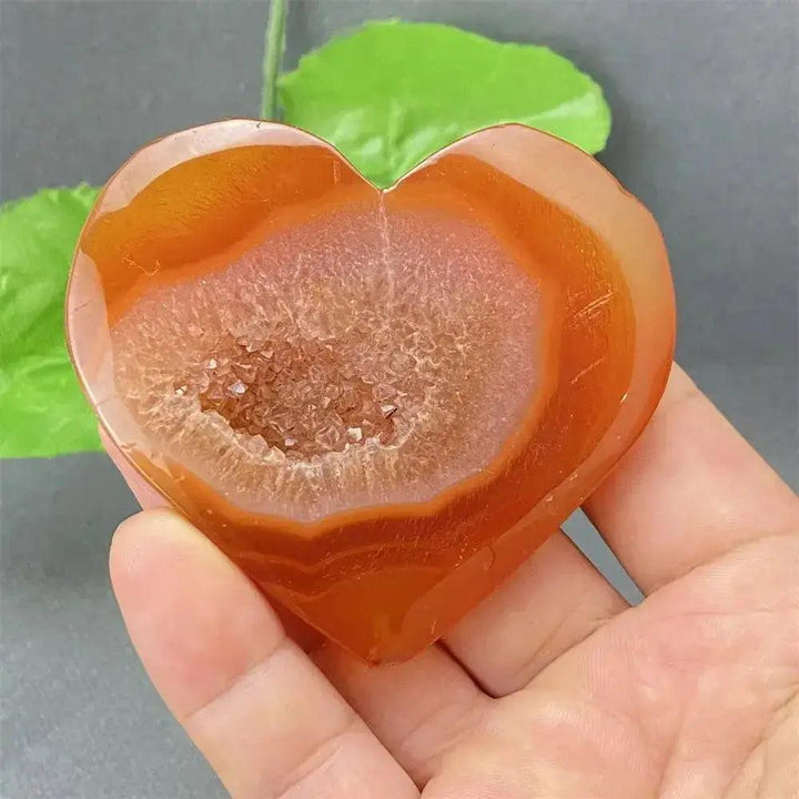 Natural Red Agate Heart Geode with sparkling druzy crystals, promoting strength and emotional balance.