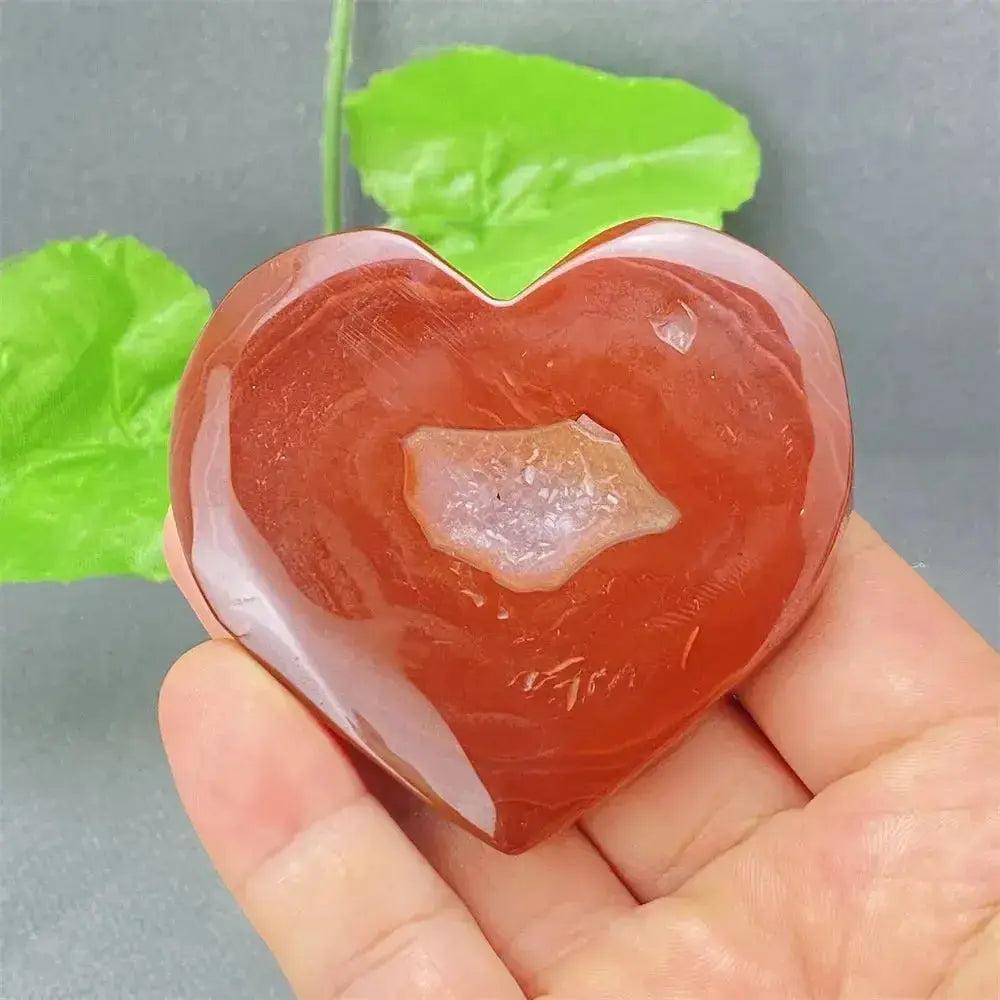 Natural Red Agate Heart Geode with sparkling druzy crystals, promoting strength and emotional balance.