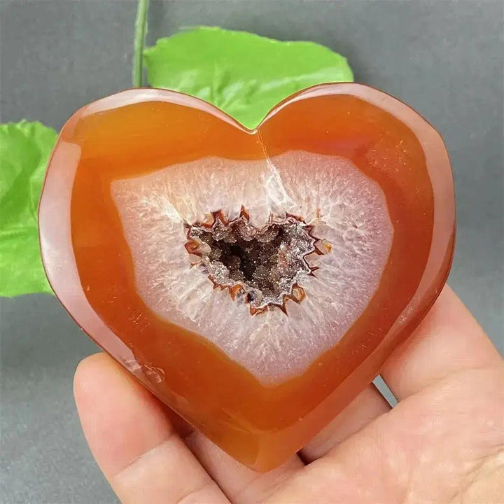 Natural Red Agate Heart Geode with sparkling druzy crystals, promoting strength and emotional balance.