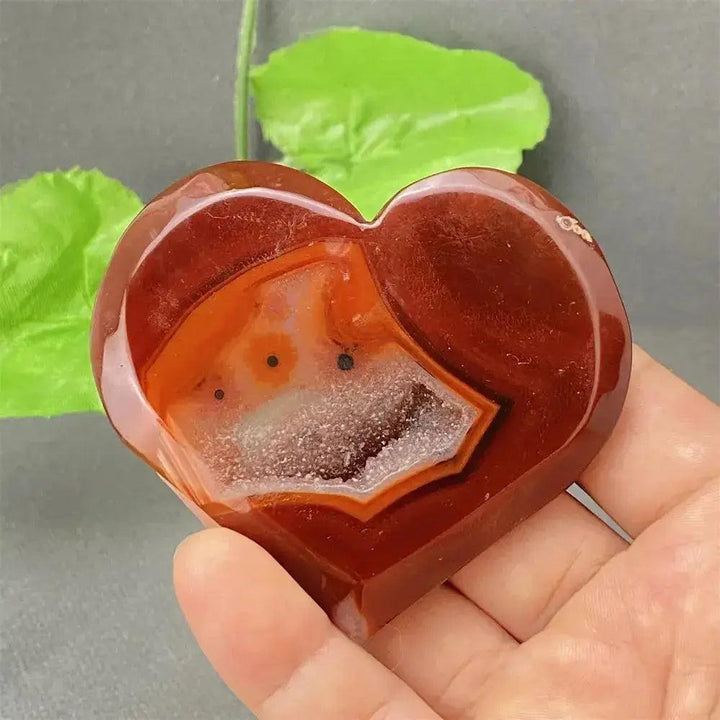 Natural Red Agate Heart Geode with sparkling druzy crystals, promoting strength and emotional balance.
