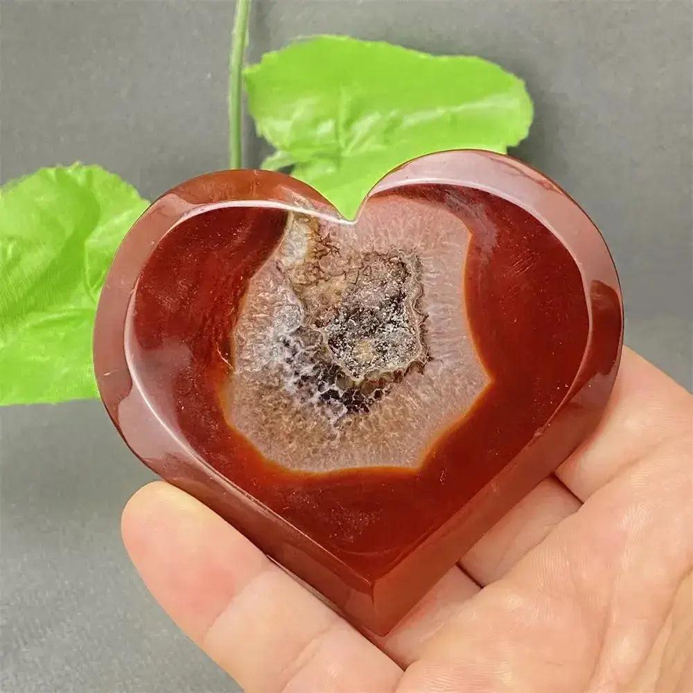 Natural Red Agate Heart Geode with sparkling druzy crystals, promoting strength and emotional balance.