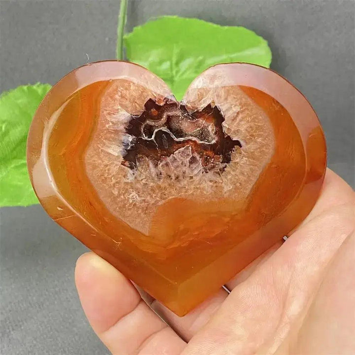 Natural Red Agate Heart Geode with sparkling druzy crystals, promoting strength and emotional balance.