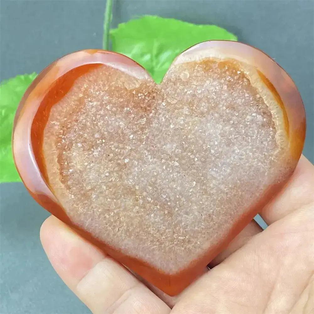 Natural Red Agate Heart Geode with sparkling druzy crystals, promoting strength and emotional balance.