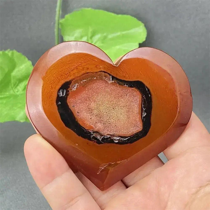 Natural Red Agate Heart Geode with sparkling druzy crystals, promoting strength and emotional balance.