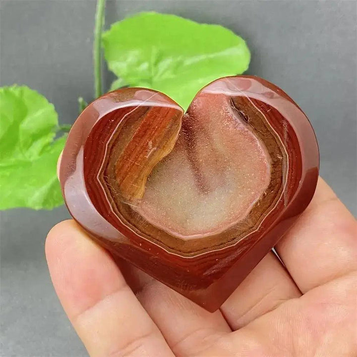 Natural Red Agate Heart Geode with sparkling druzy crystals, promoting strength and emotional balance.