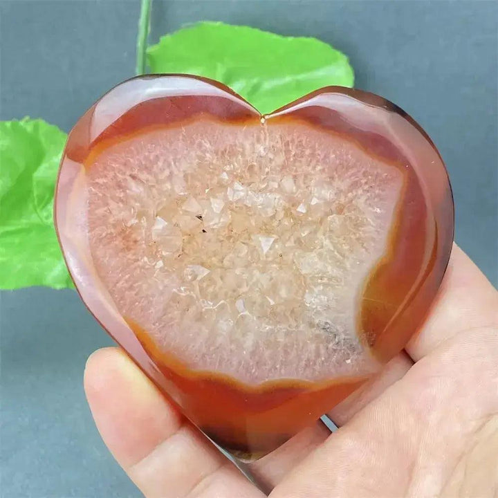 Natural Red Agate Heart Geode with sparkling druzy crystals, promoting strength and emotional balance.
