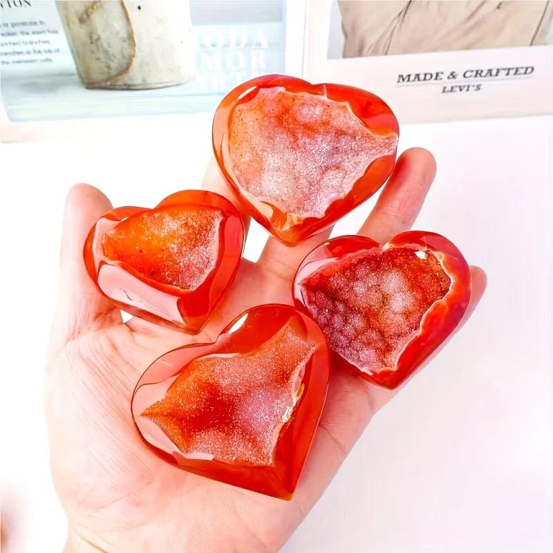Polished red agate heart-shaped stones with sparkling natural crystal druzy centers.