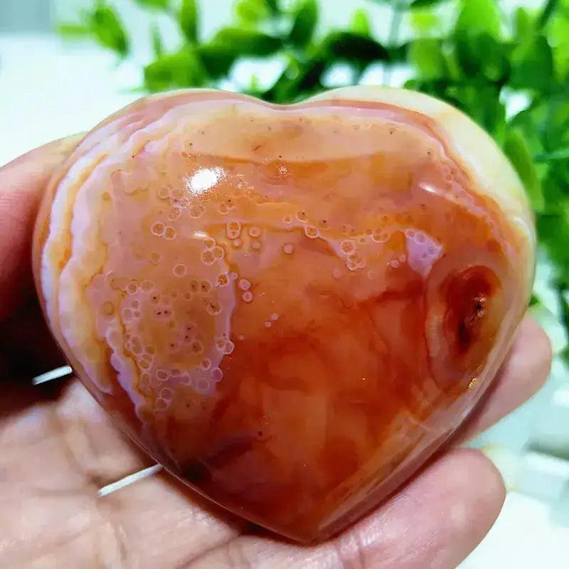 Polished Red Agate heart, a Root Chakra grounding vitality stone, showcasing rich red tones and natural banding.