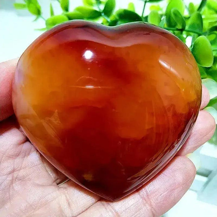 Polished Red Agate Heart, a Root Chakra grounding vitality stone, radiating warm earthy tones and natural banding.