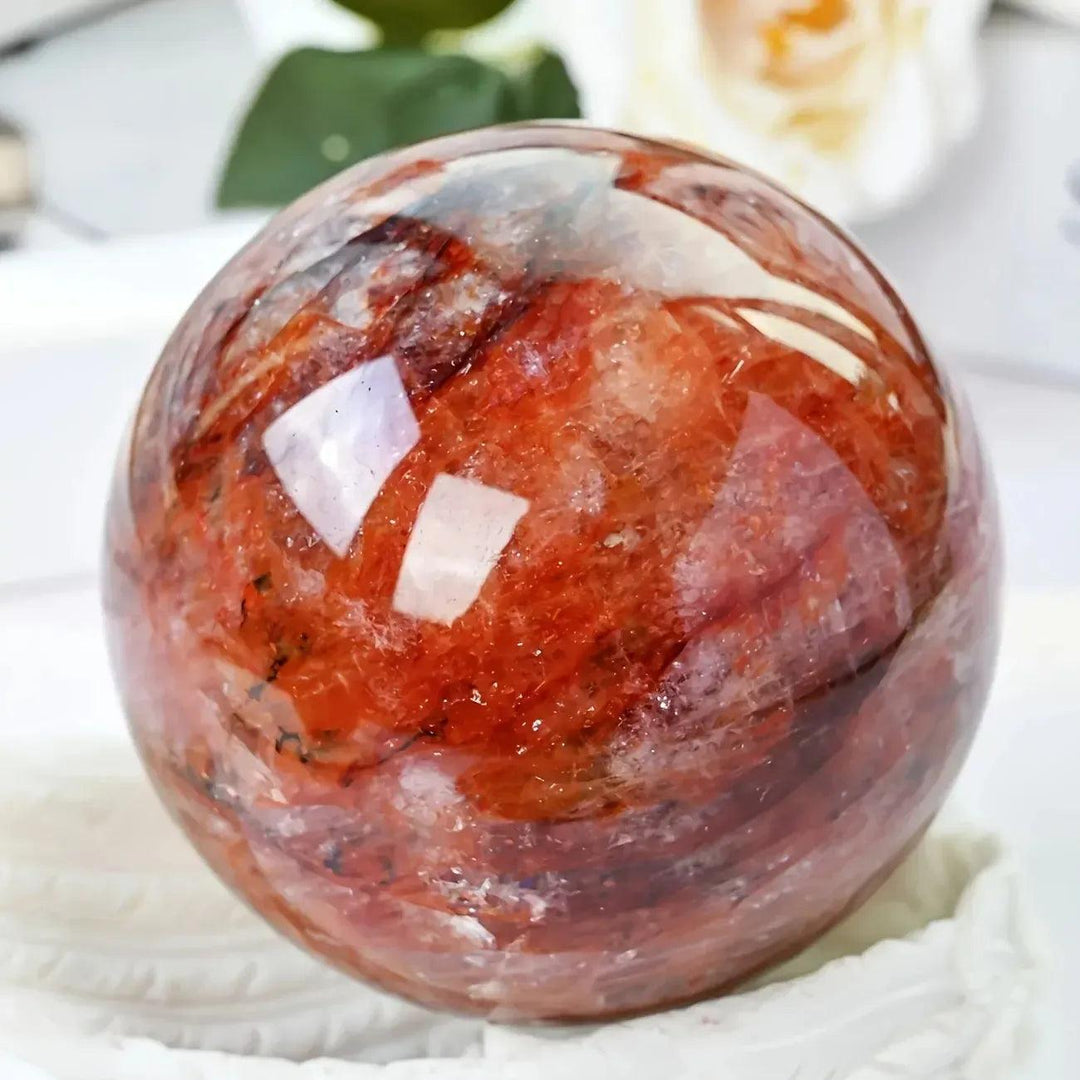 Stunning Red Hematoid Fire Quartz Sphere with fiery red and orange inclusions, radiating passionate, motivating energy.