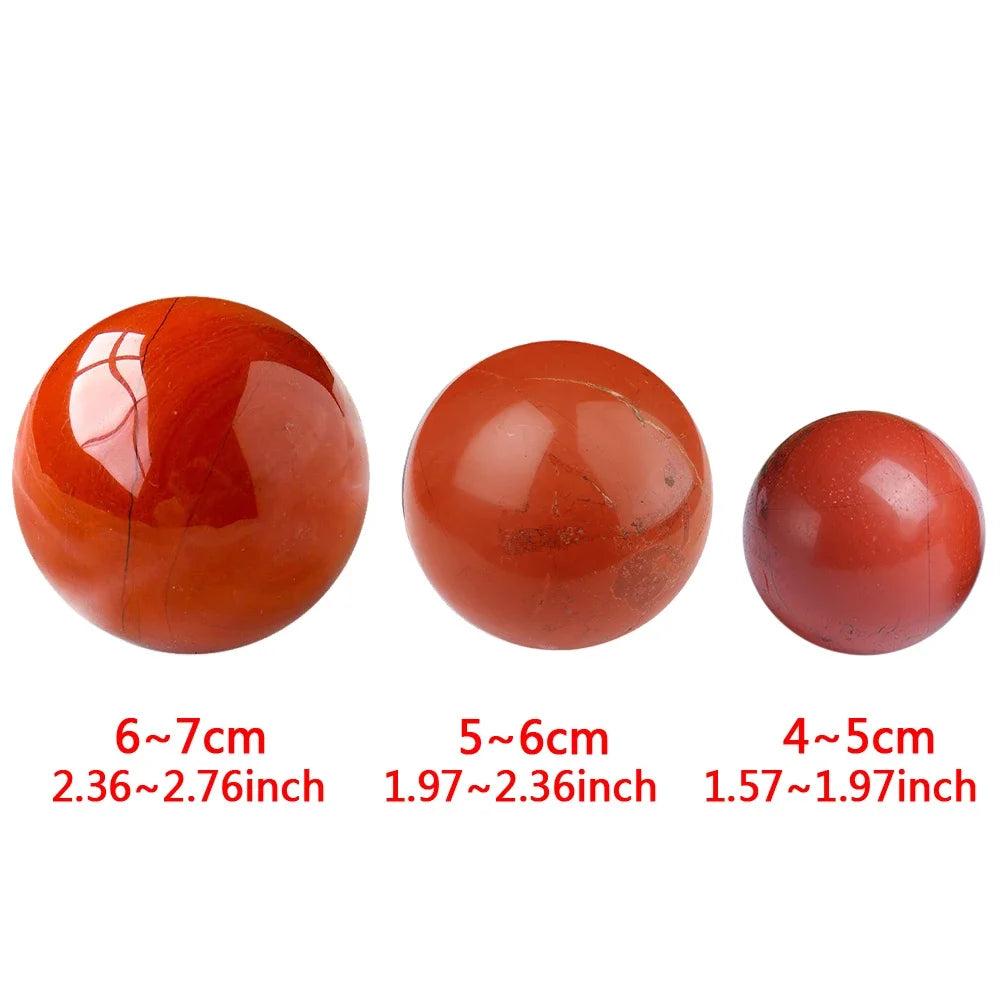 Three polished Red Jasper crystal spheres in varying sizes (4-7cm) for grounding, vitality, and quiet strength.