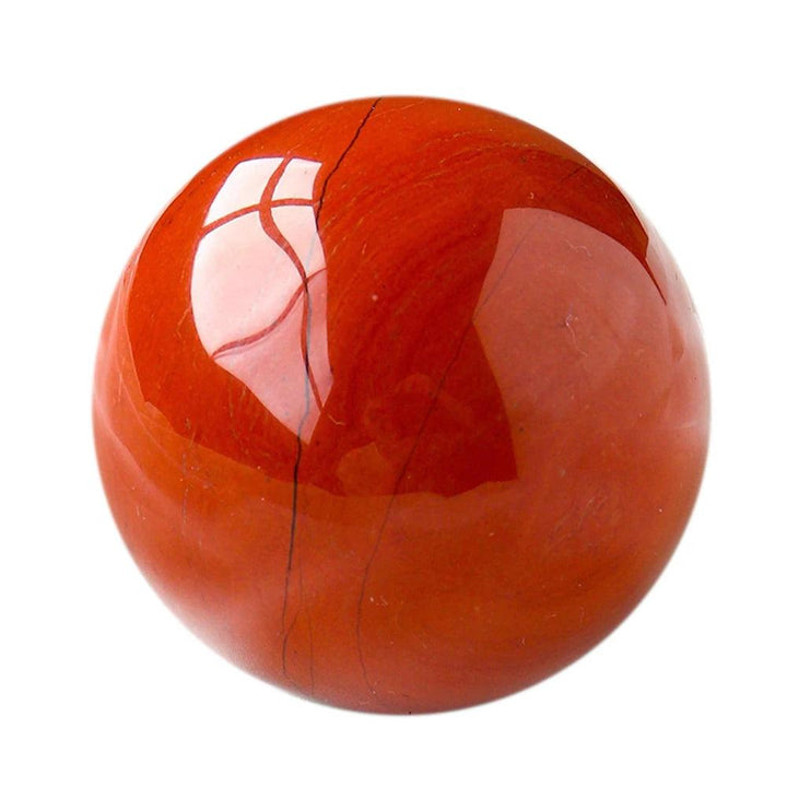 Polished Red Jasper Crystal Sphere, a deep brick-red grounding stone radiating vitality and quiet strength.