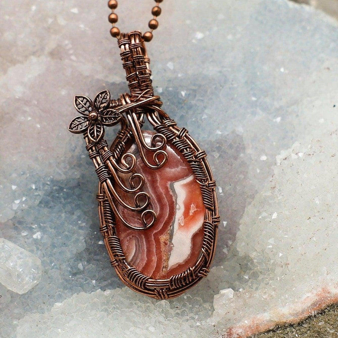 Rhodochrosite Wire Wrap Pendant, 2.45" genuine pink and cream banded stone in handcrafted healing copper with flower accent.