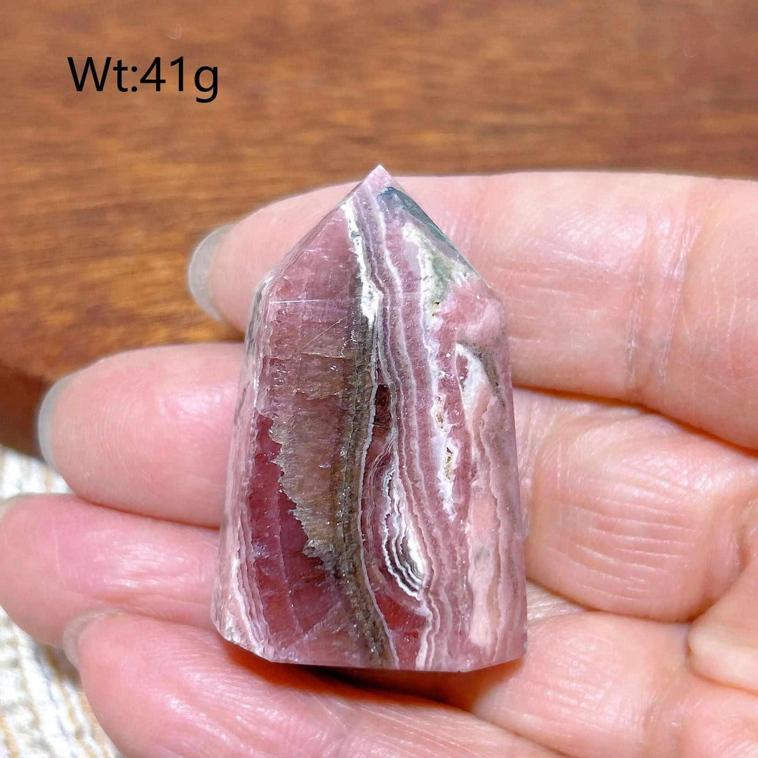 Polished 41g Rhodochrosite tower point featuring beautiful rose pink and white banding for heart chakra healing.