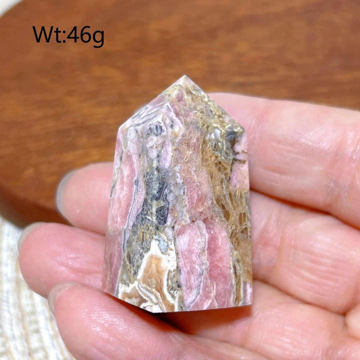 Polished 46g Rhodochrosite tower point featuring beautiful rose pink and white banding for heart chakra healing.