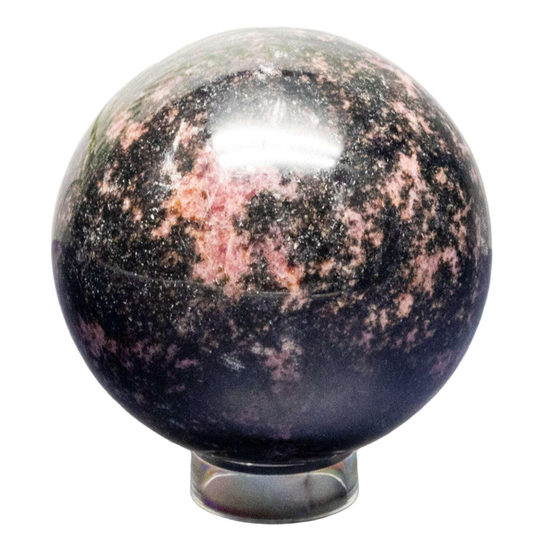 Polished Rhodonite Sphere, deep rose pink with black manganese veins, for emotional healing.