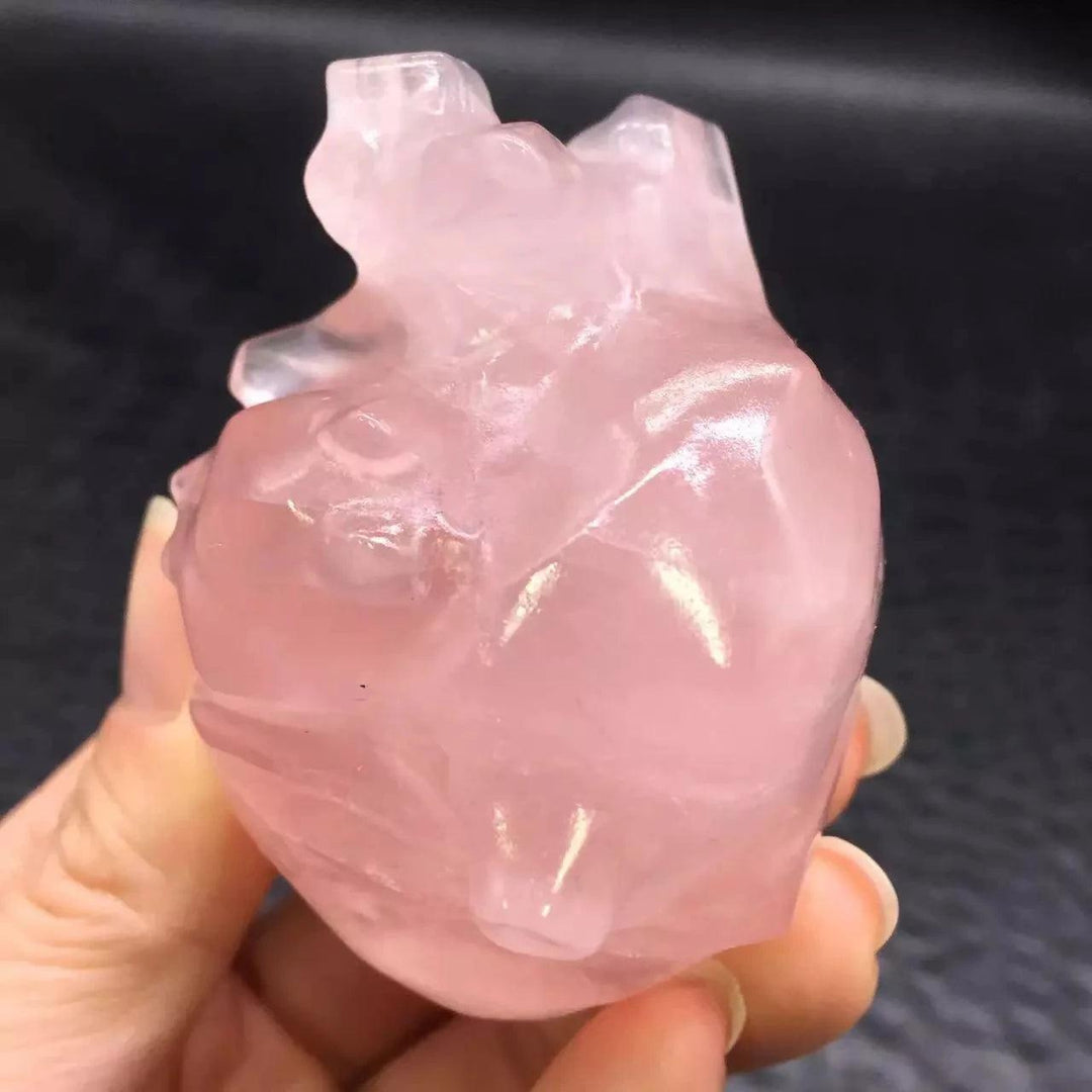 Rose Quartz Crystal Carved Anatomical Heart Sculpture, translucent pink, hand-carved, for love and healing.
