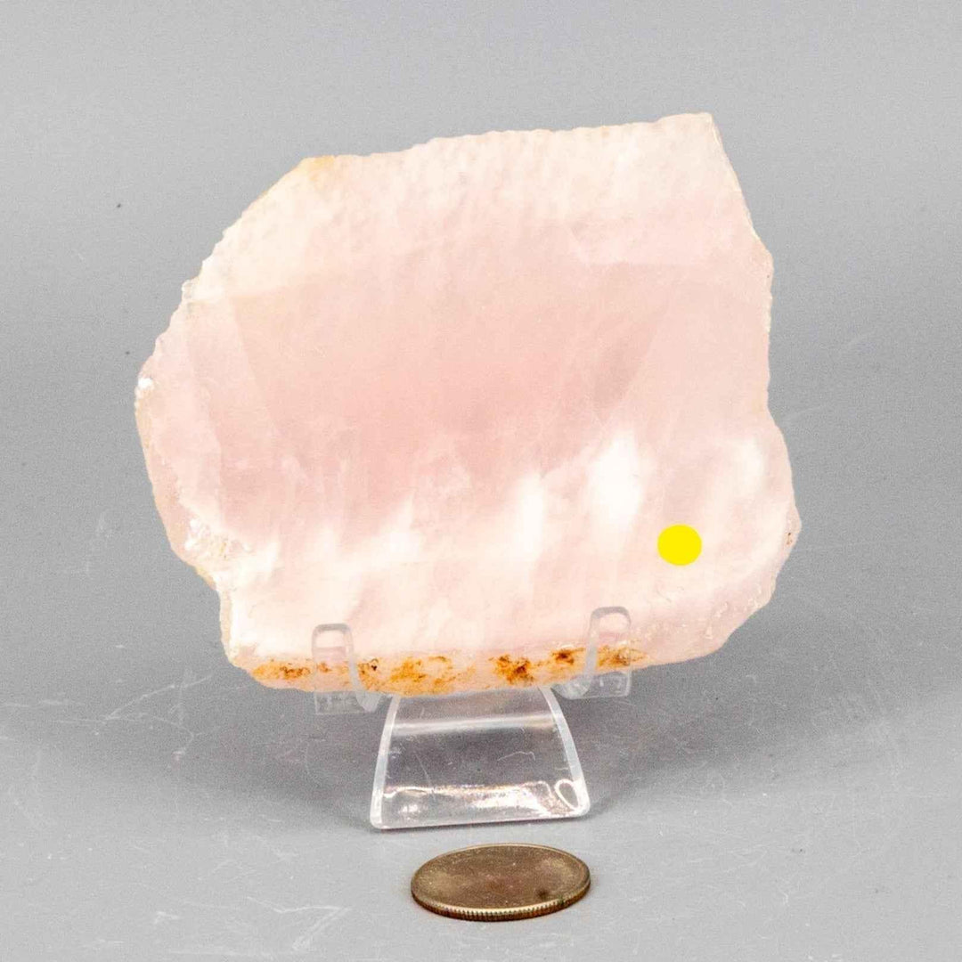 Rose Quartz Slice: Polished, translucent pink crystal with natural edges, perfect for display and gentle glow.