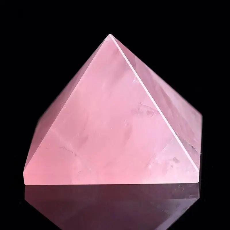Polished rose quartz crystal pyramid, soft pink, for love and healing.