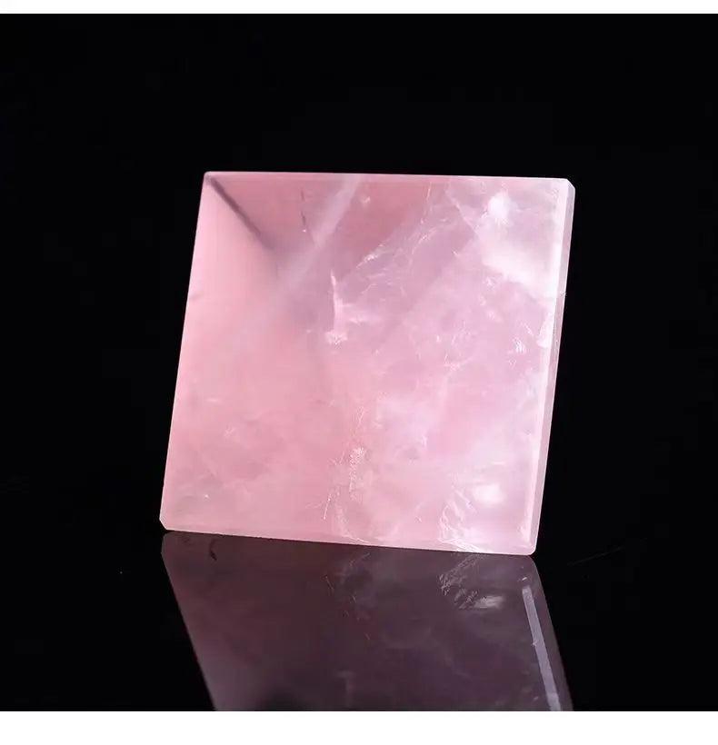 Polished natural rose quartz crystal pyramid, soft pink, for love and healing.