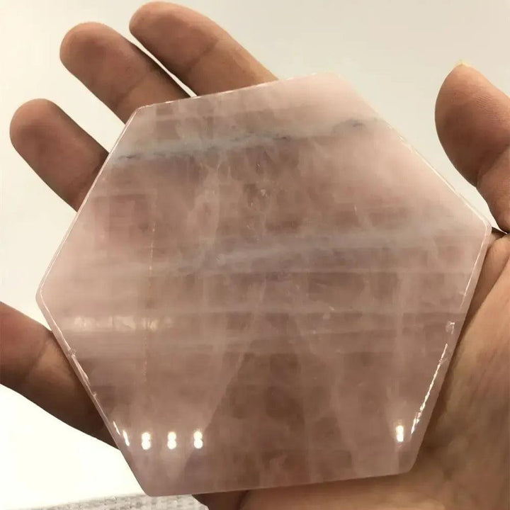 Hand-polished Rose Quartz hexagon coaster by Crystal Destiny, showcasing its soft pink hues and loving energy.
