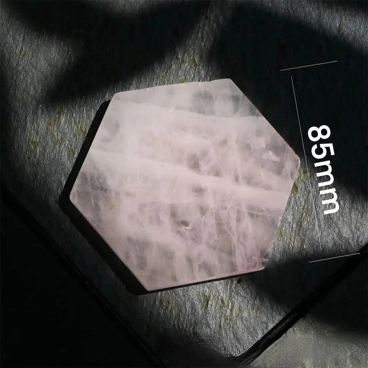 Polished 85mm Rose Quartz hexagon coaster from Crystal Destiny, showcasing its soft pink hues and loving energy.