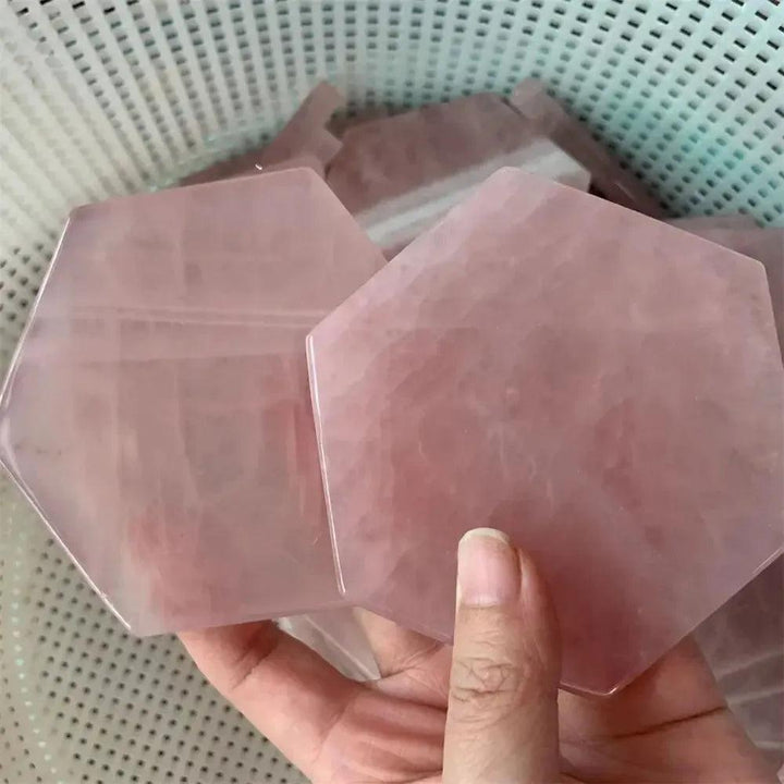Hand-polished Rose Quartz hexagon coaster by Crystal Destiny, showcasing its soft pink hue and loving energy.
