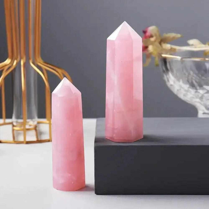 Polished rose quartz hexagonal crystal points in soft pink, perfect for Heart Chakra healing and unconditional love.