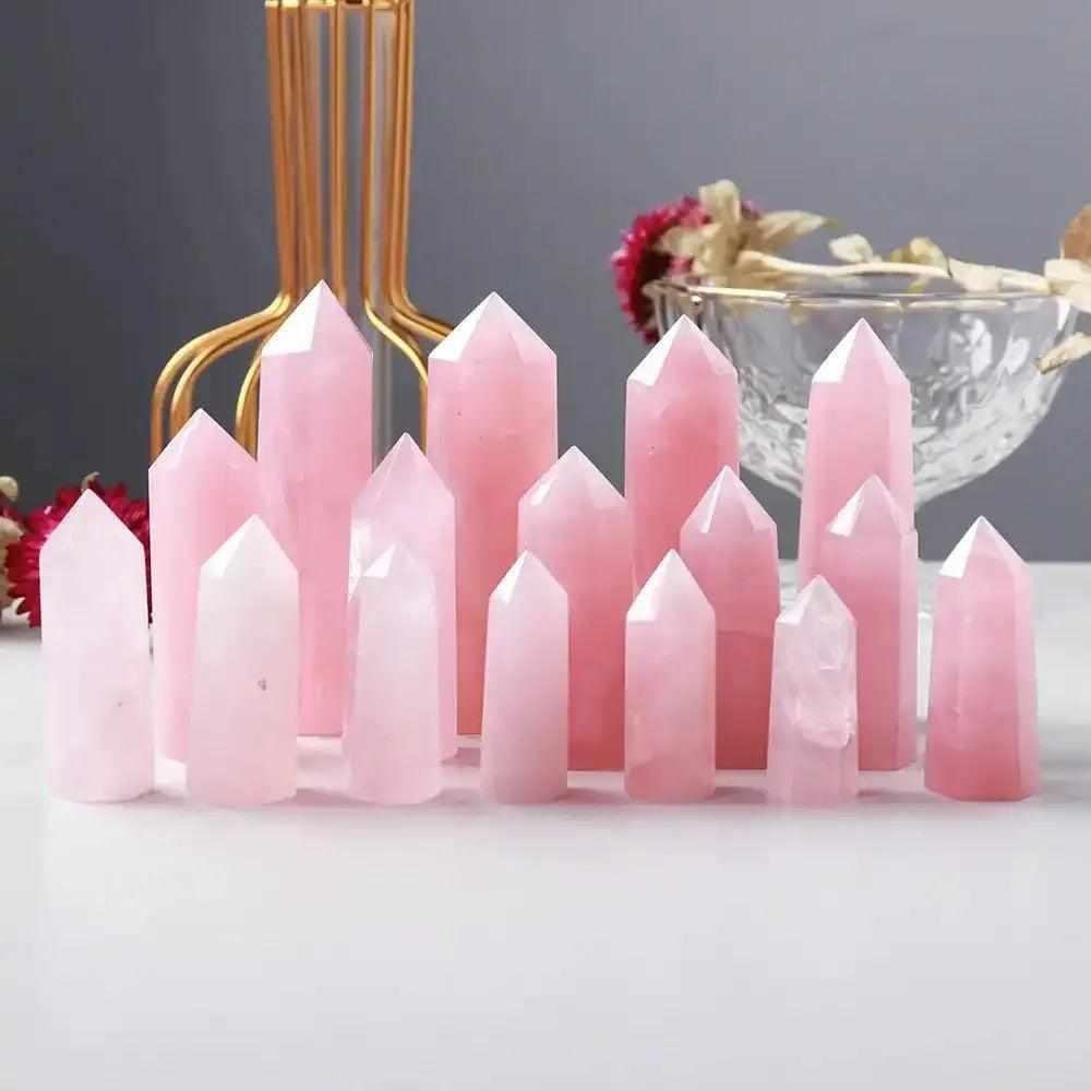 Polished rose quartz hexagonal crystal points in soft pink, perfect for heart chakra healing and unconditional love.