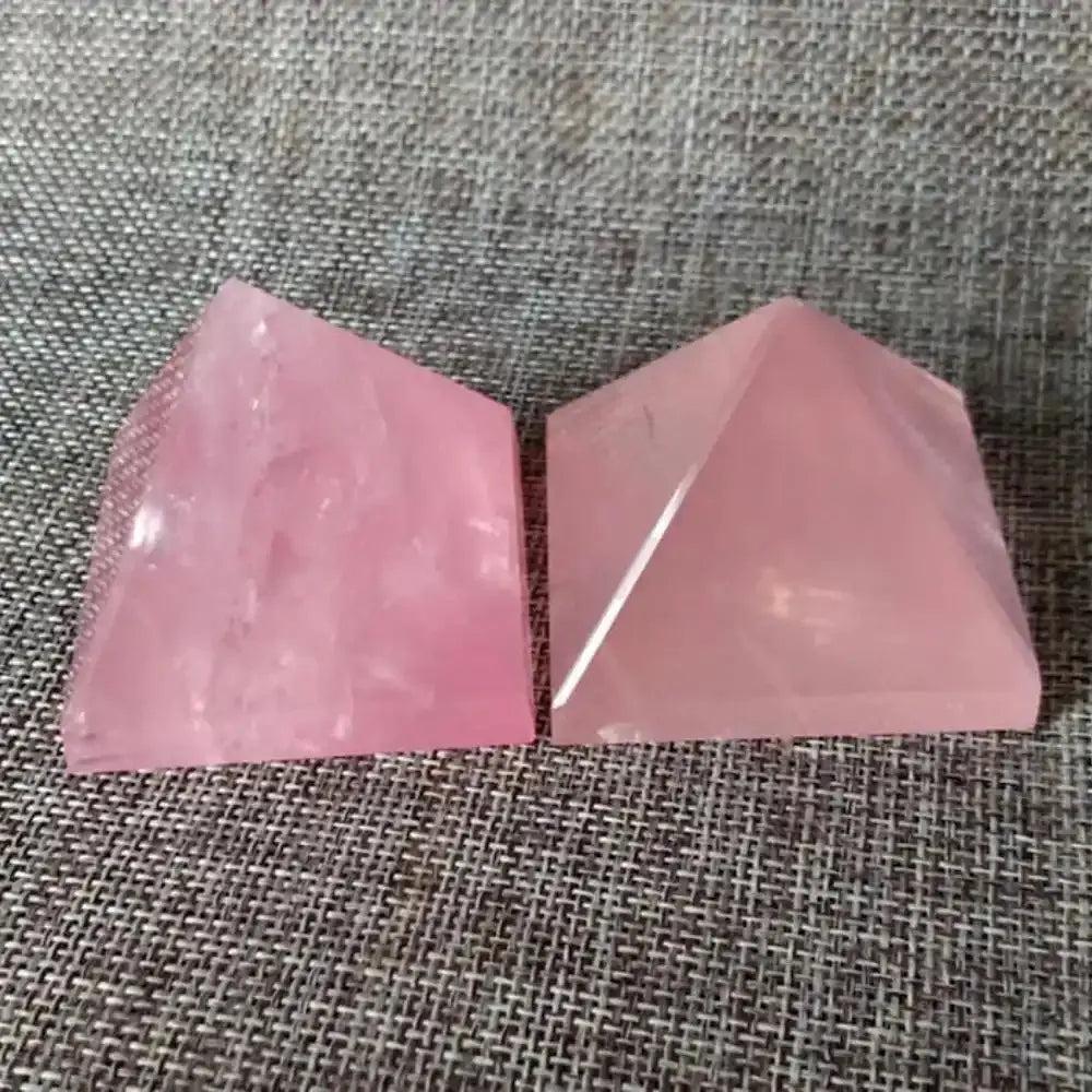 Two hand-polished Rose Quartz mini pyramids in soft, milky pink for Heart chakra healing and intention setting.