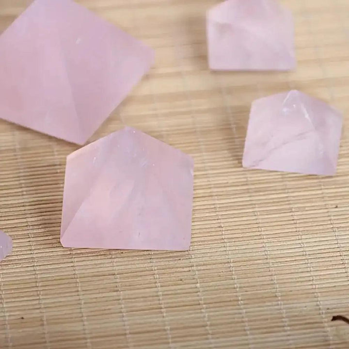 Hand-polished Rose Quartz Mini Pyramids in soft, milky pink for heart chakra healing and intention setting.