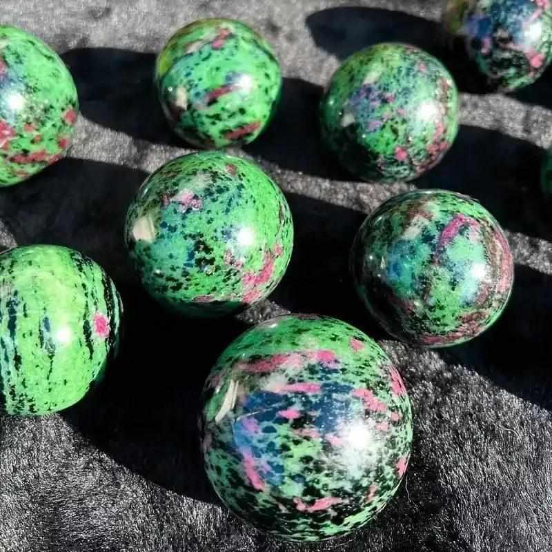 Polished Ruby Zoisite spheres featuring vibrant green, ruby red, and black patterns for heart-centered energy and vitality.