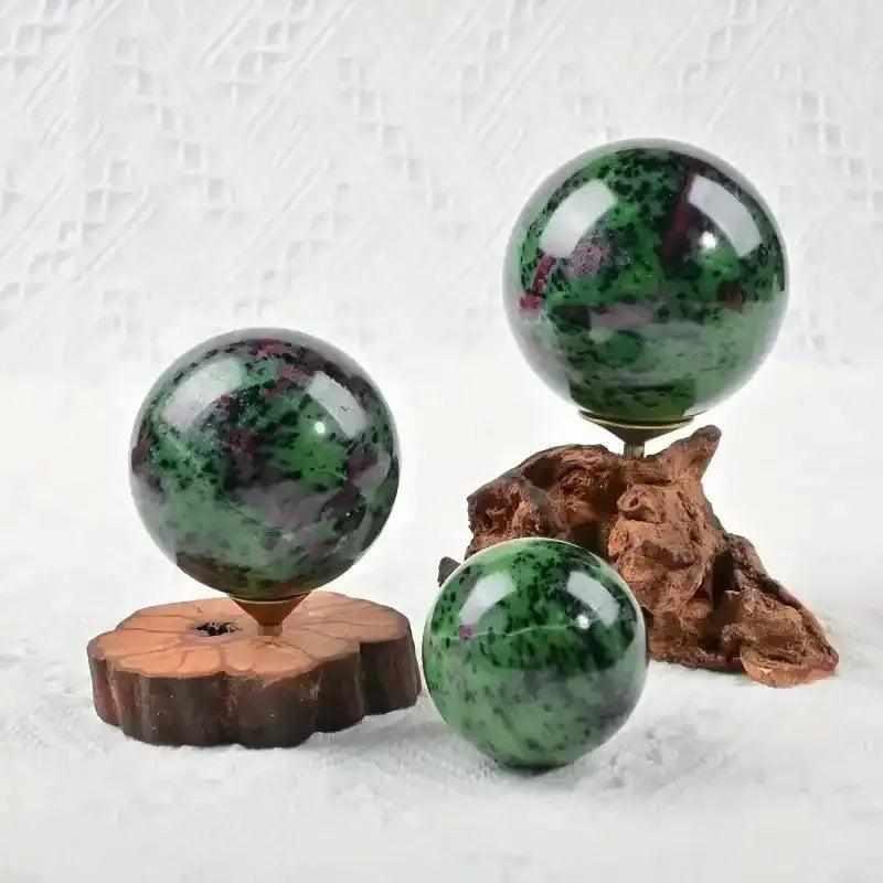 Polished Ruby Zoisite spheres featuring vibrant green, ruby red, and black patterns for heart-centered energy and vitality.