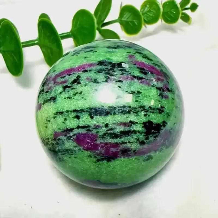 Polished Ruby Zoisite sphere featuring vibrant green, ruby red, and black flecks for heart-centered energy and vitality.