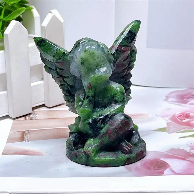 Hand-carved Ruby in Zoisite angel figurine with striking green and red-pink patterns for heart chakra healing and protection.