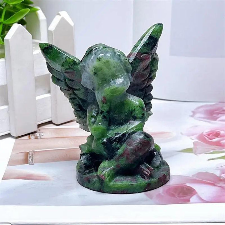 Hand-carved Ruby in Zoisite angel figurine with striking green and red-pink patterns for heart chakra healing and protection.