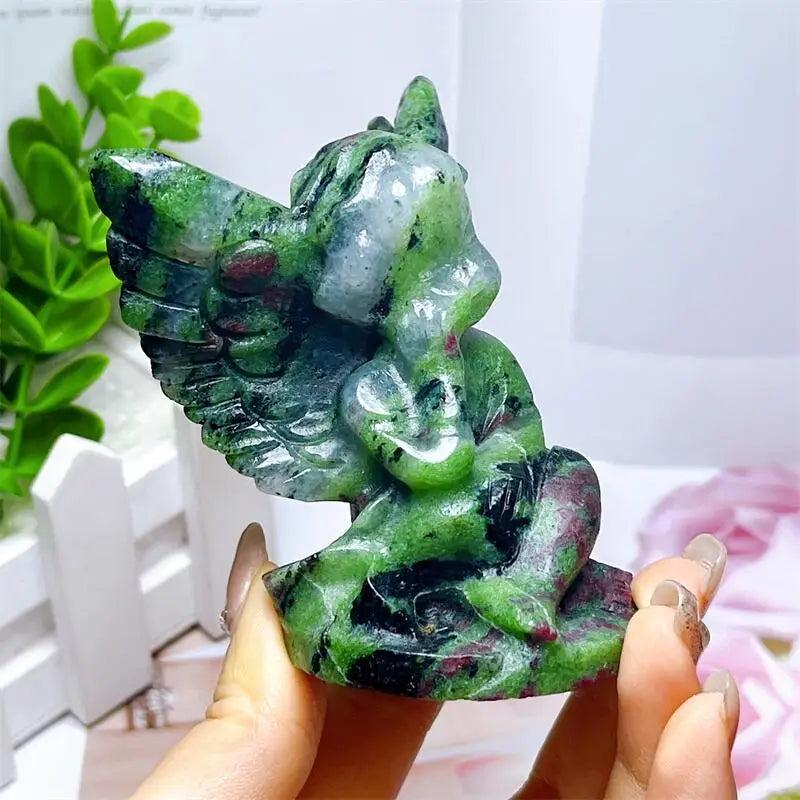 Hand-carved Ruby in Zoisite angel figurine featuring striking green and vivid red-pink patterns for heart chakra healing.