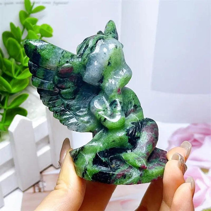 Hand-carved Ruby in Zoisite angel figurine featuring striking green and vivid red-pink patterns for heart chakra healing.
