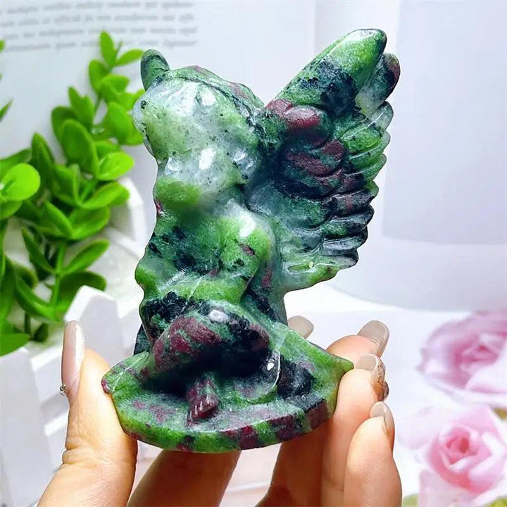 Hand-carved Ruby in Zoisite angel figurine featuring striking forest green and vivid red-pink patterns for heart healing.