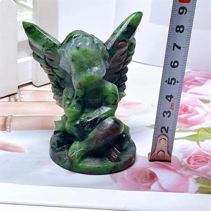 Hand-carved Ruby in Zoisite angel figurine featuring striking forest green and vivid red-pink patterns for heart healing.
