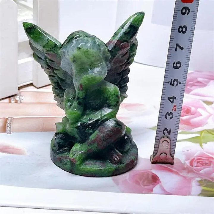 Hand-carved Ruby in Zoisite angel figurine featuring striking forest green and vivid red-pink patterns for heart healing.